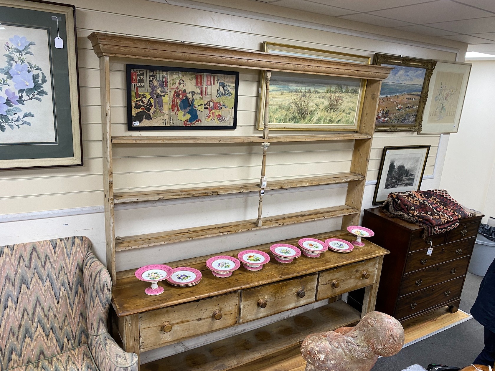 A large 19th century pale pine kitchen three drawer dresser, with open rack, length 214cm, depth 51cm, height 228cm